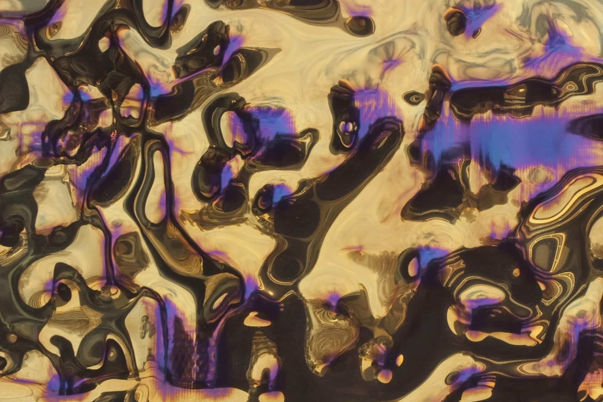 GOLD LIGHT INTERFERENCE STAINLESS STEEL WITH DEEP UNDULATED SURFACE.