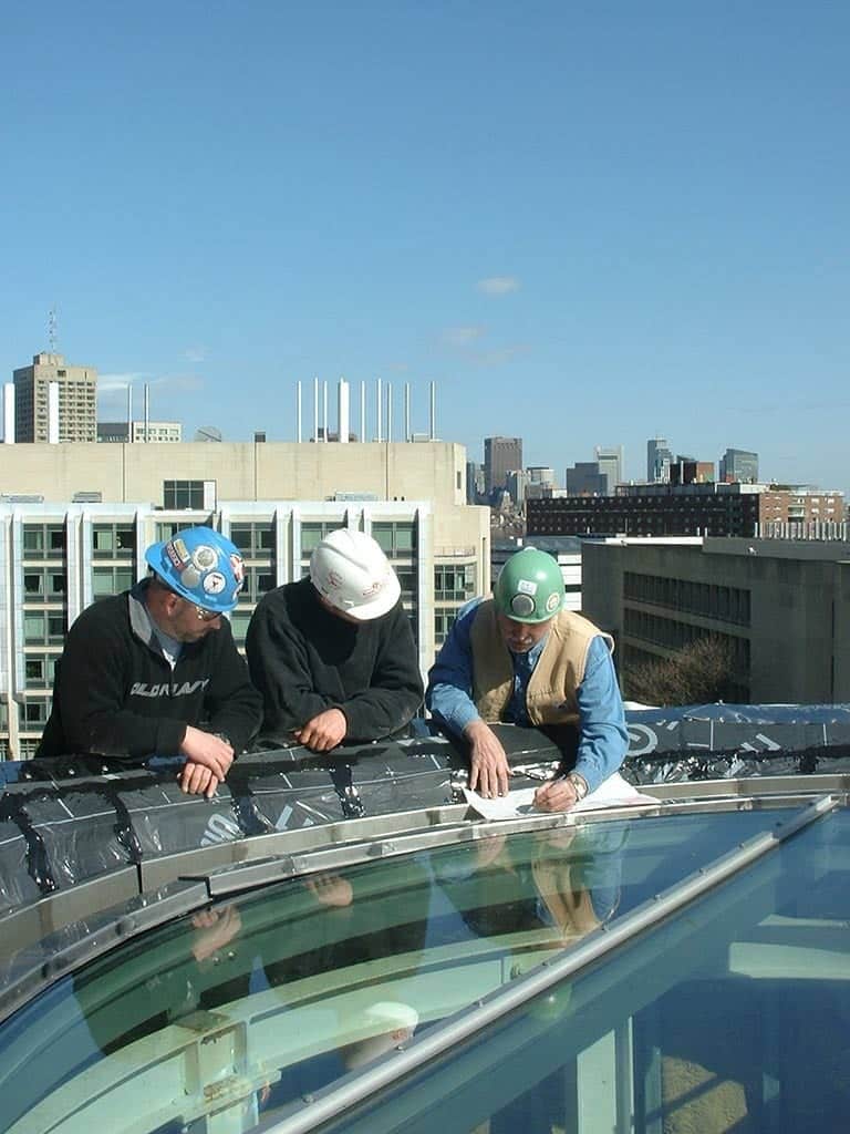 Facade installers in their office at MIT.