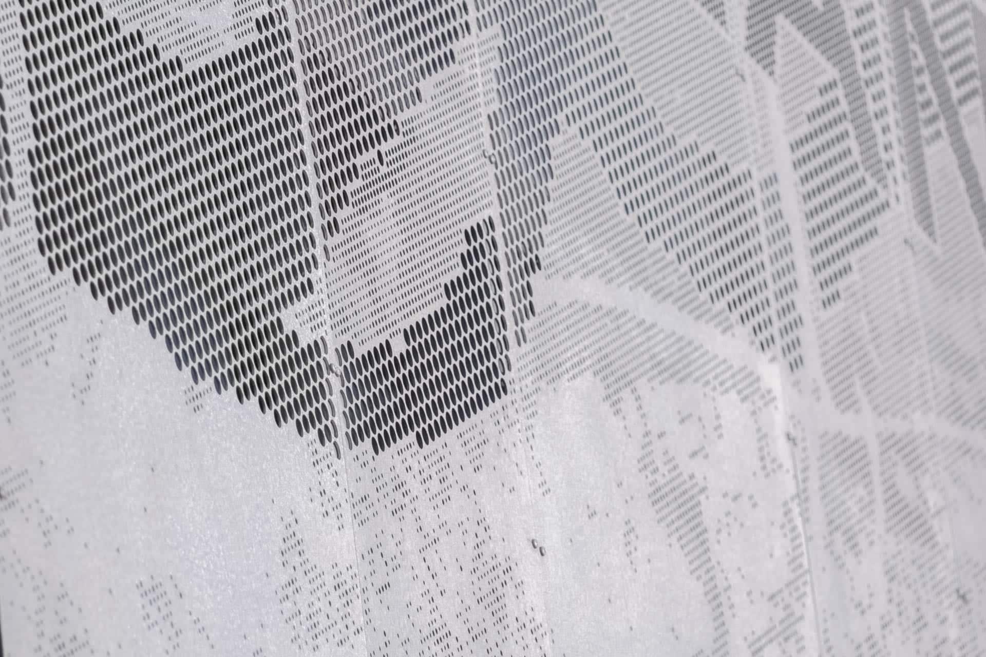 Detail of the ImageWall Perforated Metal Signage used for Highland Park in Minnesota.