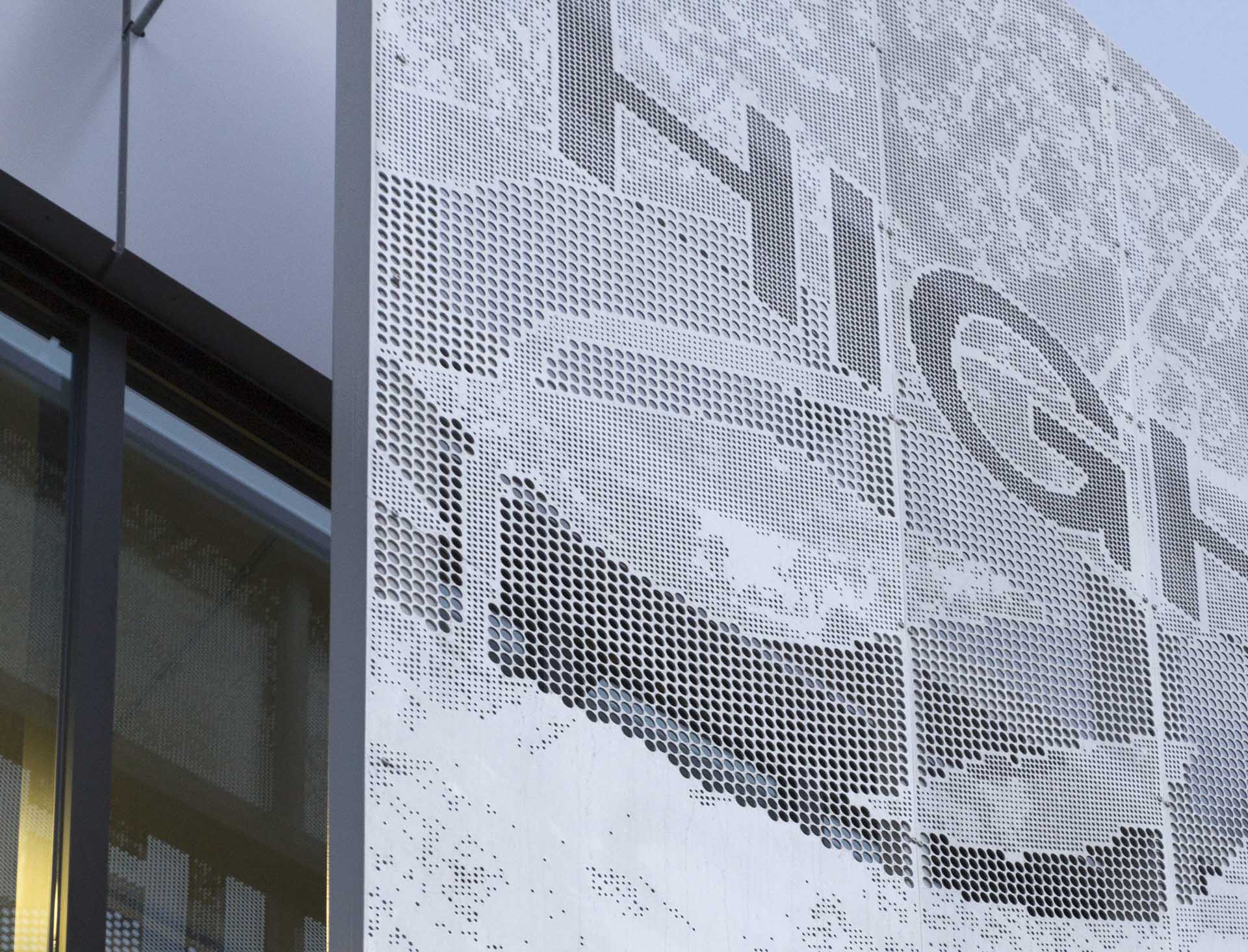 Detail of the perforated metal signage for Highland Park Community Center.