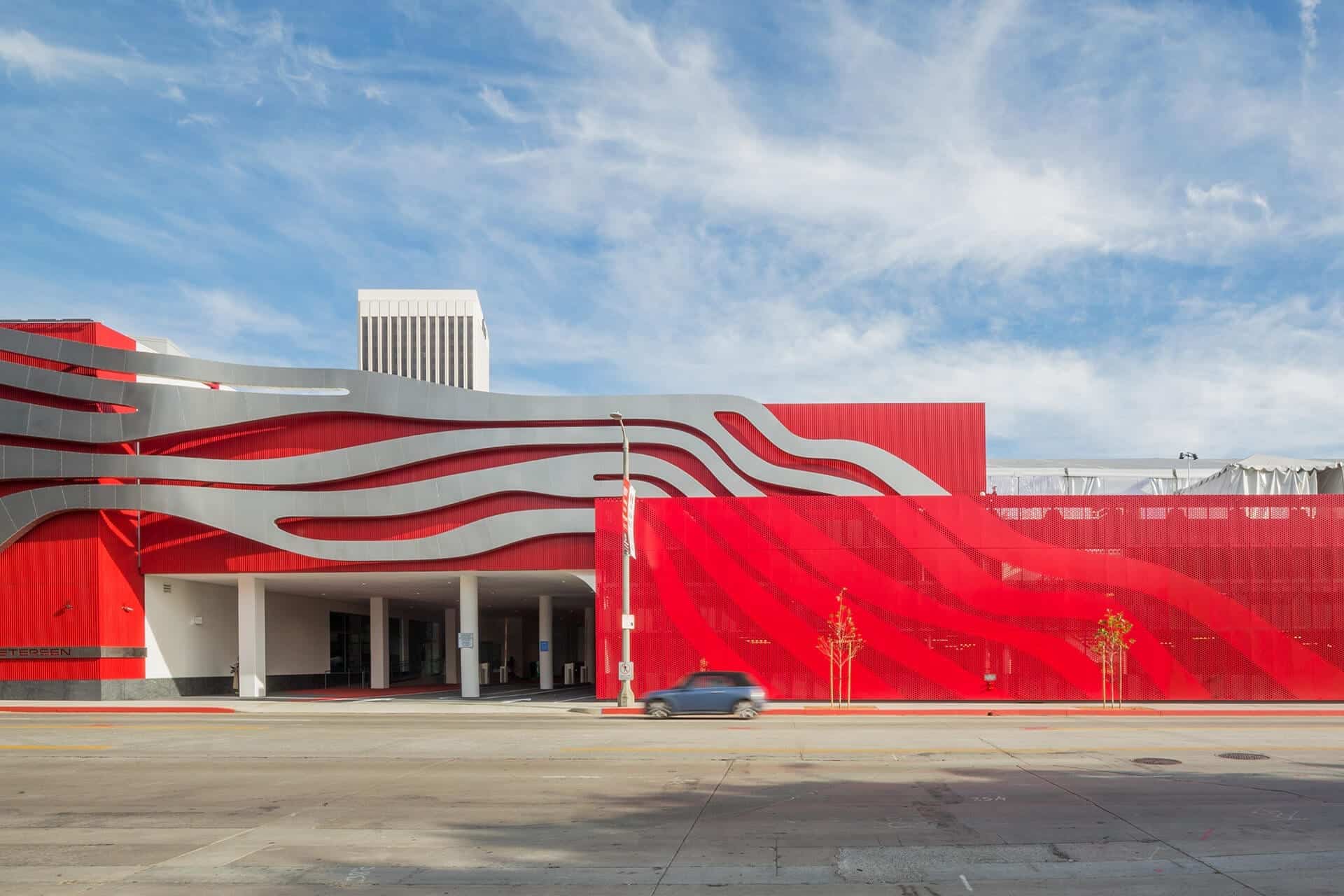 Perforated metal screenwall by Zahner continues the Petersen Automotive Museum's sculptural motif.