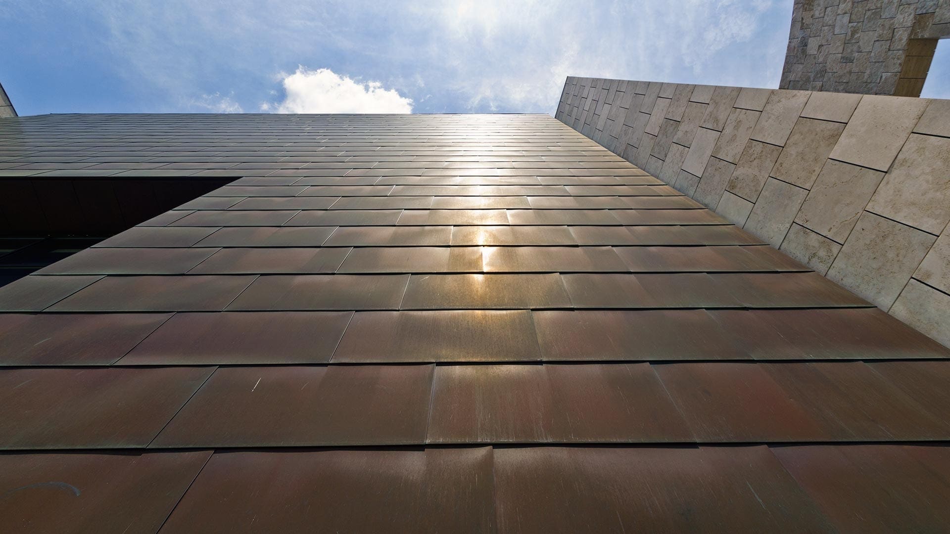 Upward view of the Freedom Center copper panels which have patinated to a dark red-brown.