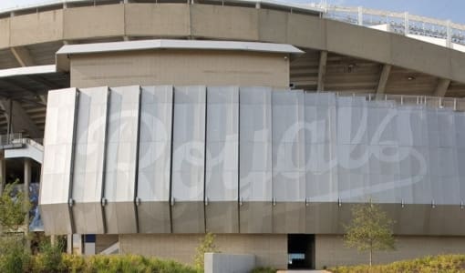 KAUFFMAN STADIUM FACADE WITH PERFORATED “ROYALS” LOGO EMBLAZONED ON ITS WALL.
