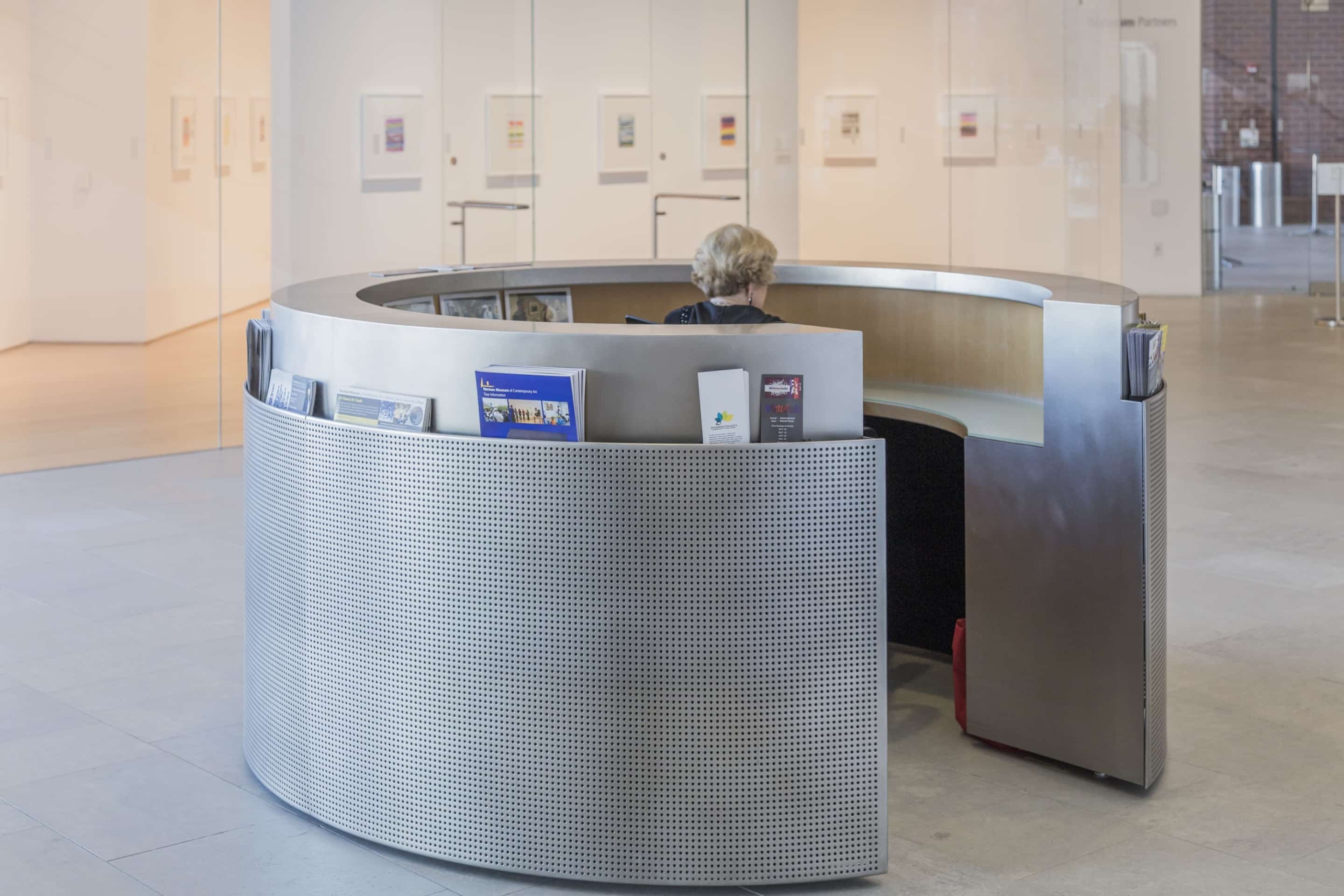 Custom stainless steel reception desk for the Nerman Museum of Contemporary Art