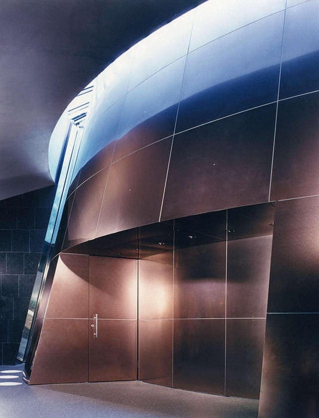 The interior titanium surface reflects less light