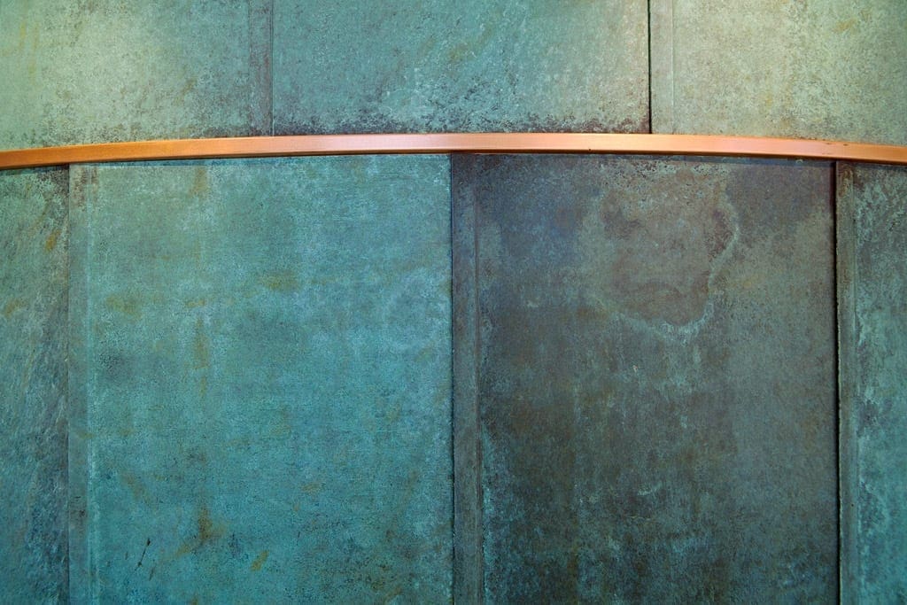 Detail of the artistic pre-patinated copper at SMU Collins.
