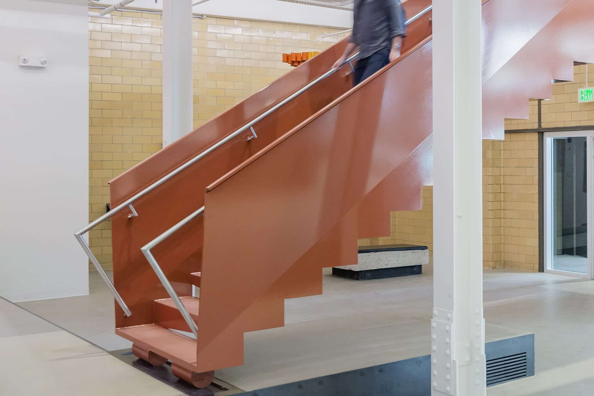 The design includes a clever handrail extension, meeting ADA requirements.