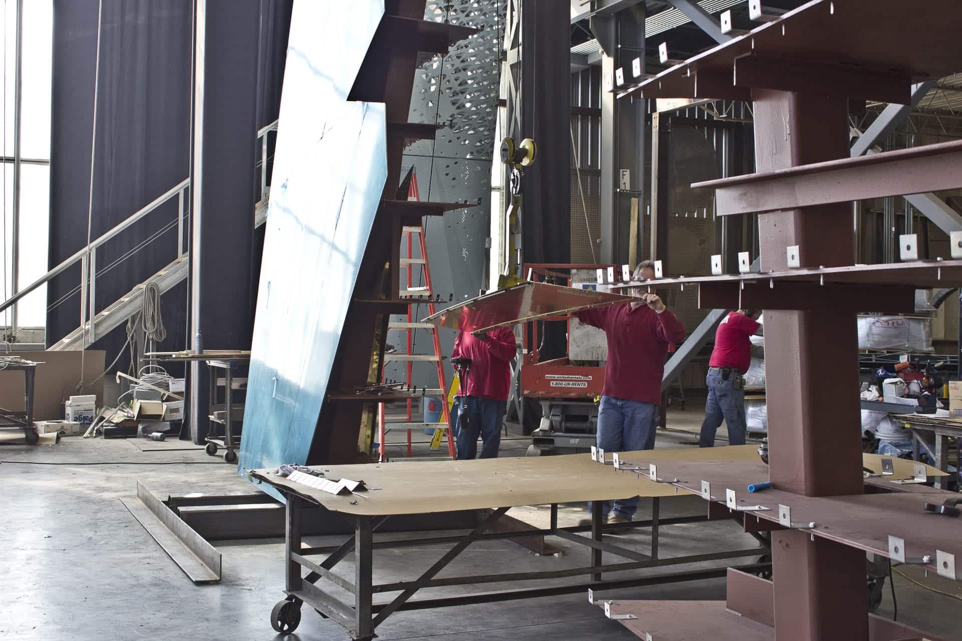 Fabricators at Zahner place panels on the Ohio Statehouse Holocaust Memorial