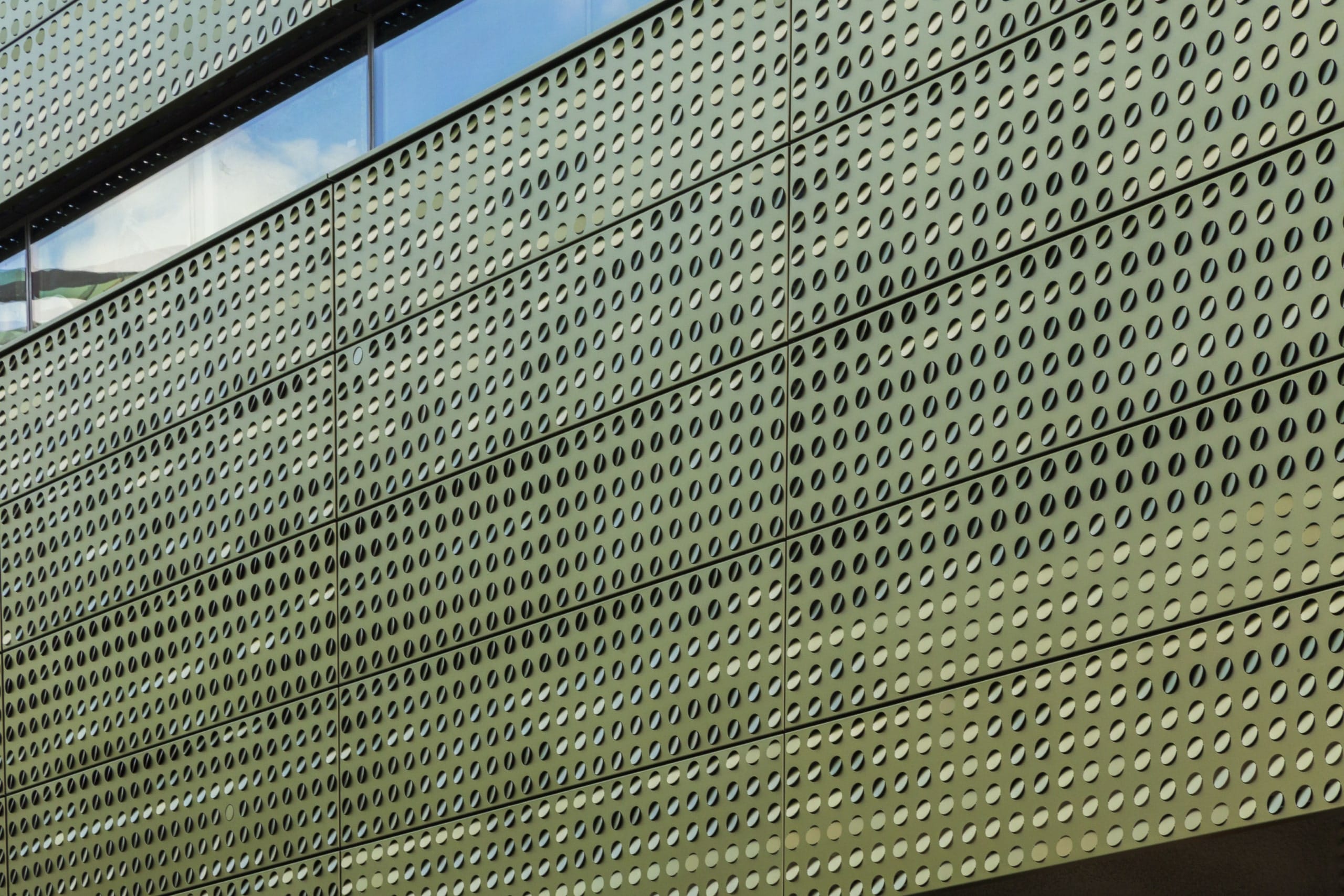 Image-perforated metal with color-shift iridescent painted aluminum.