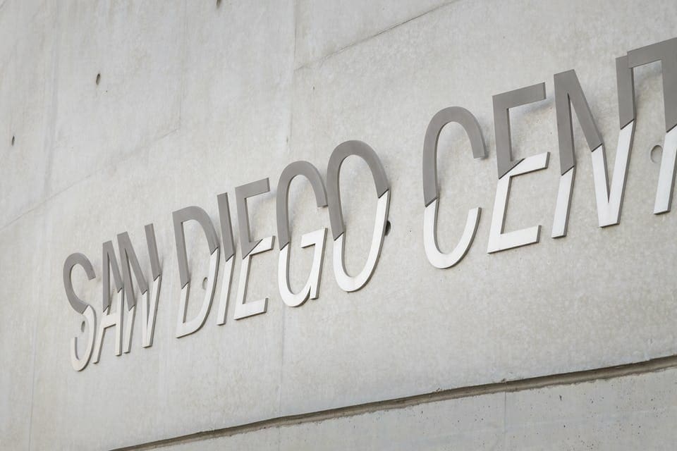 Custom signage system for San Diego Central Library designed by Luce et Studio.