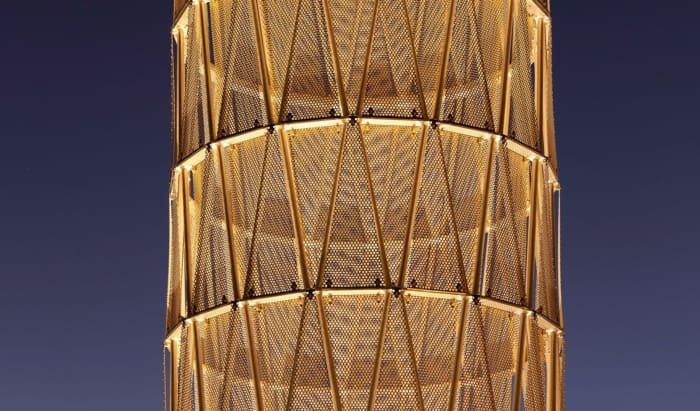 Perforated panels on Hope Tower at UNMC at dusk.