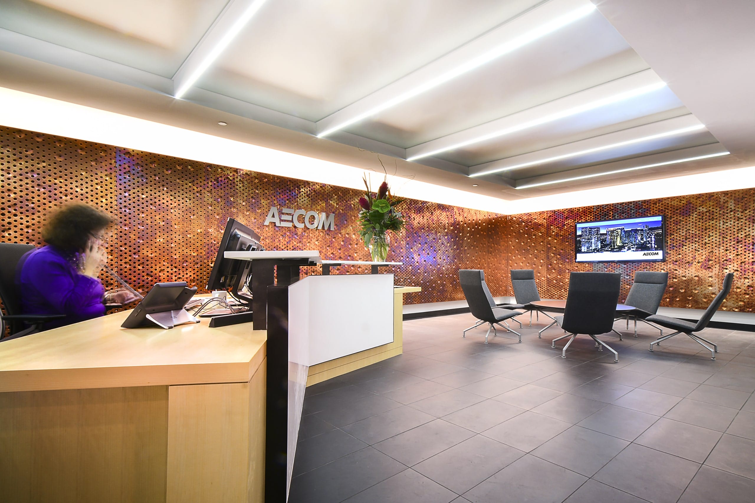 AECOM CLEVELAND OFFICE RECEPTION AREA WITH EMBOSSED DIRTY PENNY SURFACE