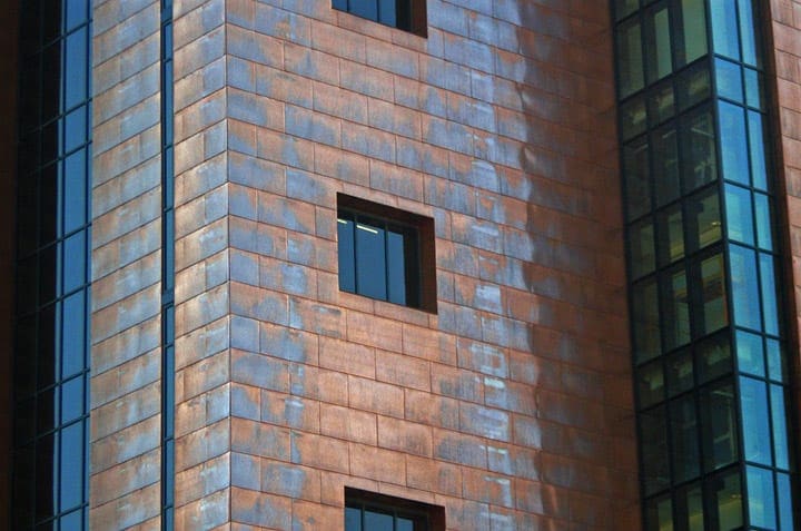 The patina begins to form on the surface of the recently completed courthouse.
