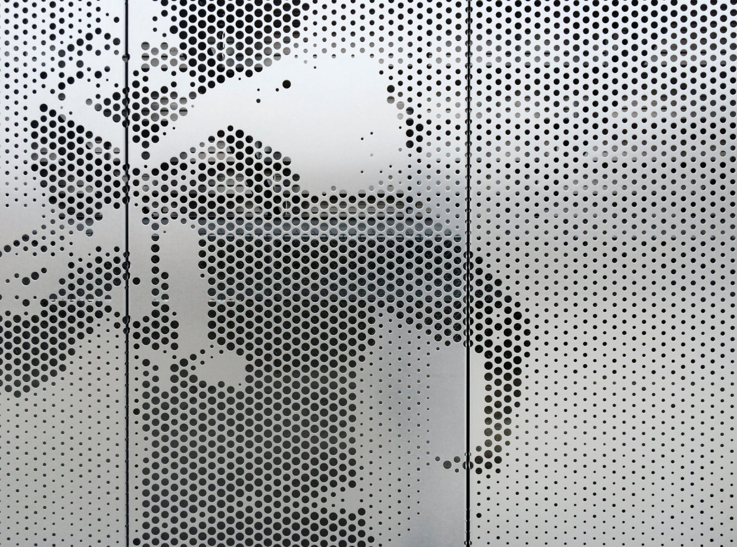 Cross-seam perforation is a standard feature of ImageWall perforated metal.