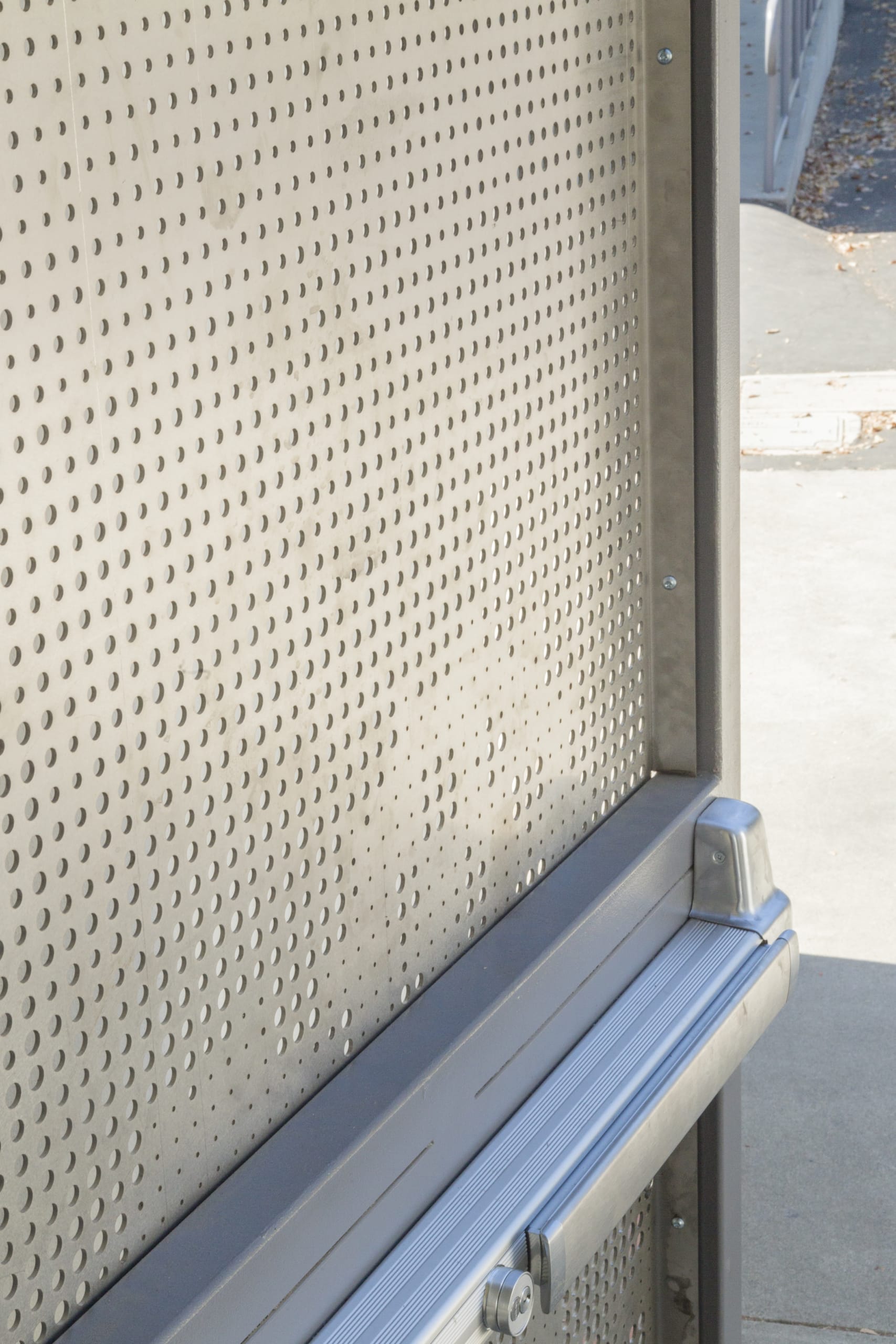 Detail of the perforated stainless steel door.