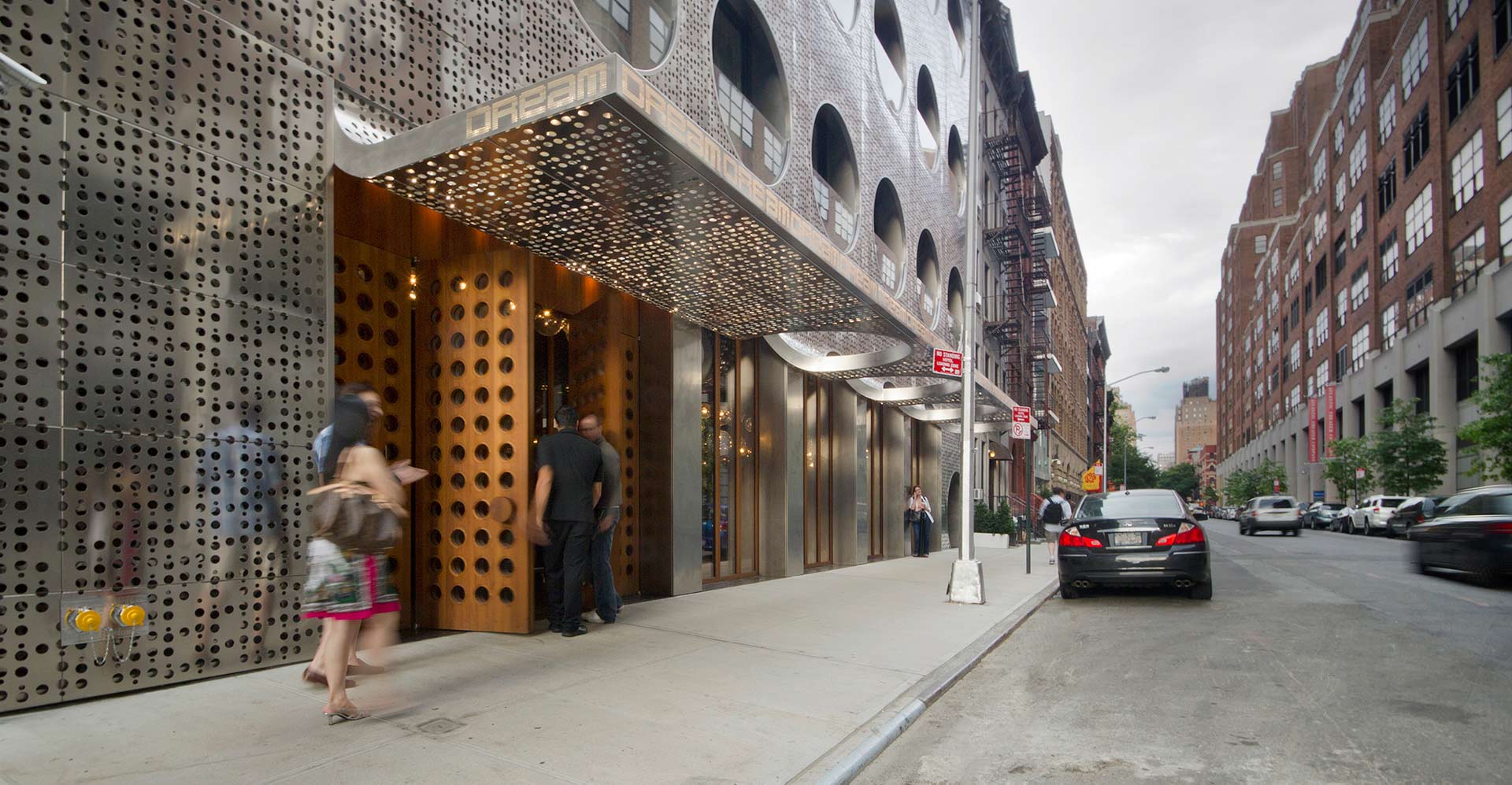 Hotel guests enter the south entrance of the Dream Hotel in NYC.