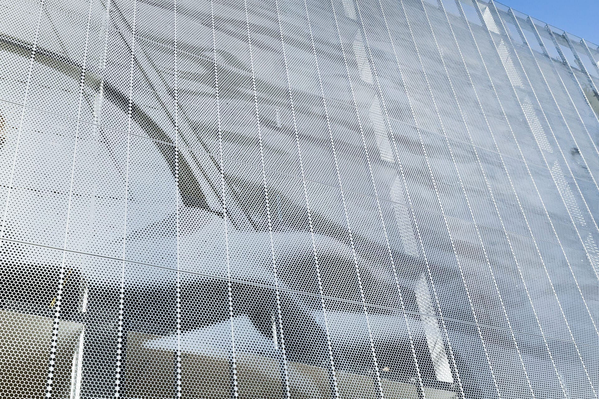 Parking garage facade designed by artist John Baldessari using ImageWall and Angel Hair Stainless Steel.