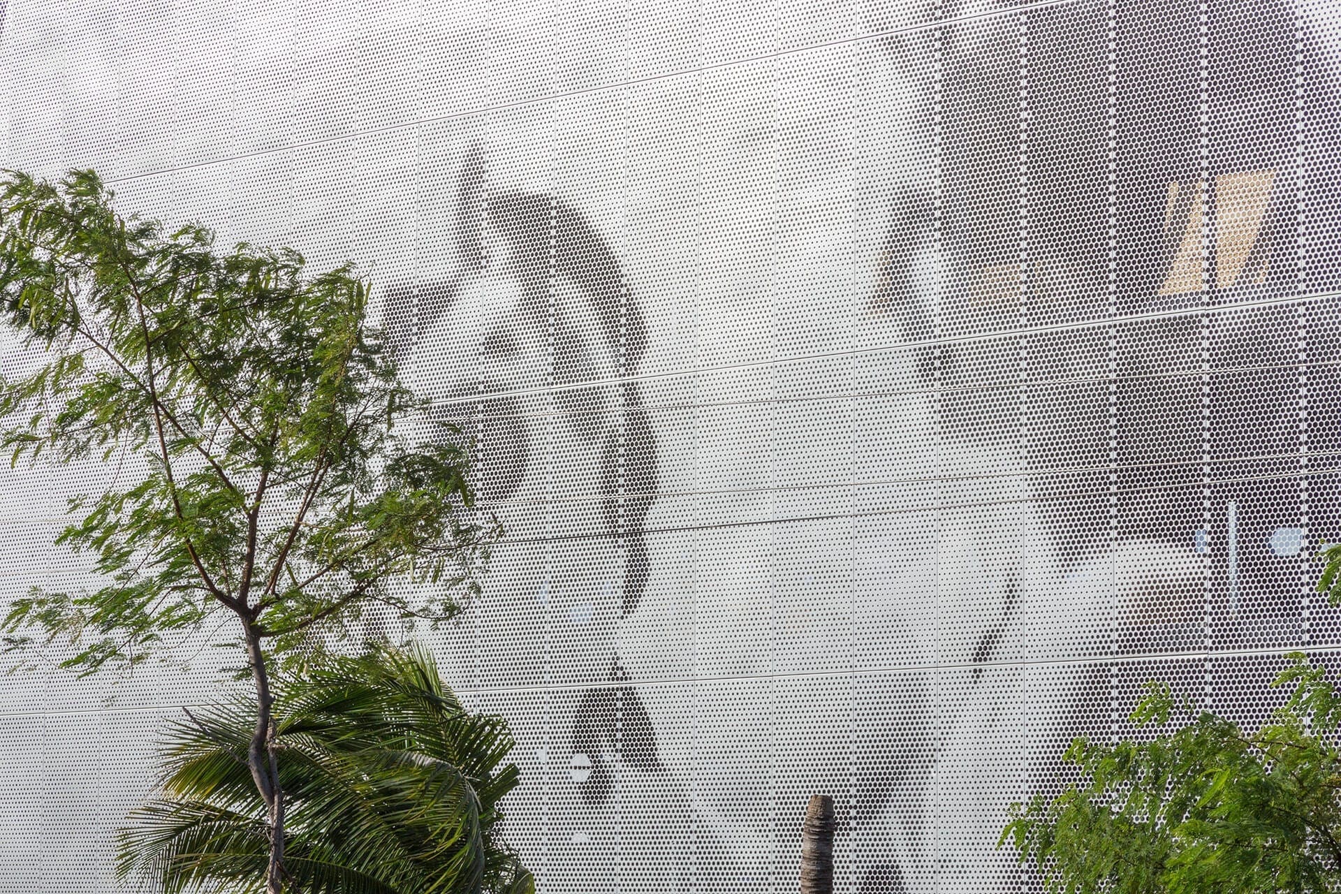 Parking garage facade designed by artist John Baldessari using ImageWall and Angel Hair Stainless Steel.