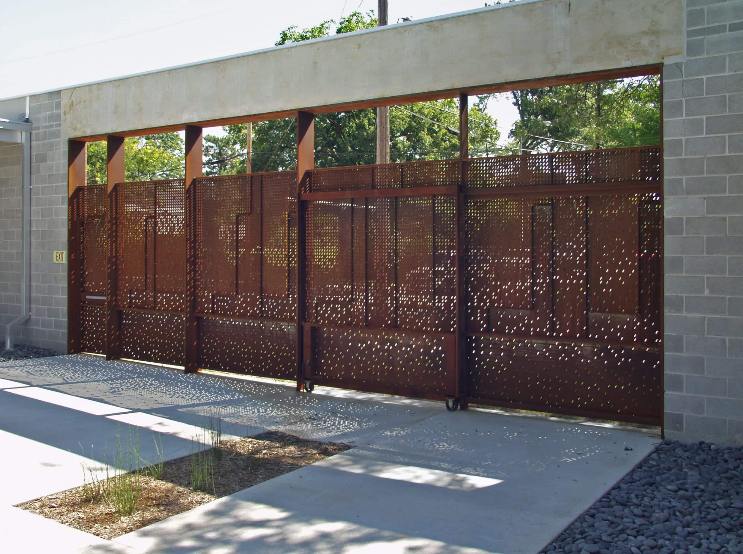 LIGHT ENTERS THE SPACE THROUGH THE CUSTOM PERFORATED METAL FOR THE IRVING COURTYARD SCREENWALL.