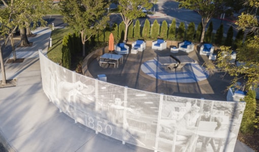 Curved free-standing ImageWall screen in painted aluminum for 1850 Gateway Courtyard.