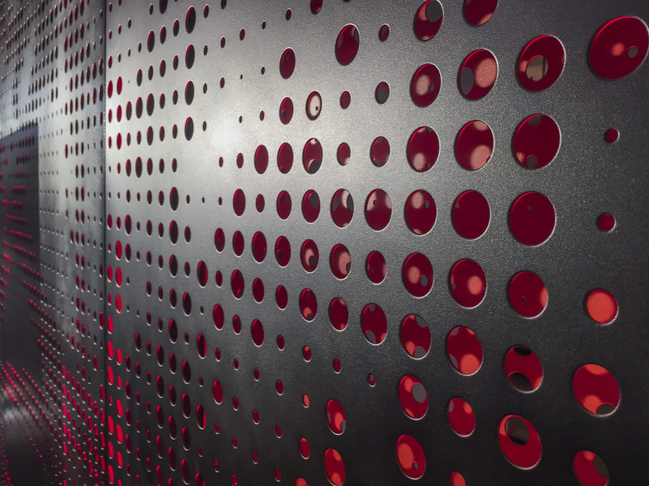 twitter-headquarters-perf-metal-1838 Screens and wall panels in painted aluminum for the Twitter corporate office in San Francisco.