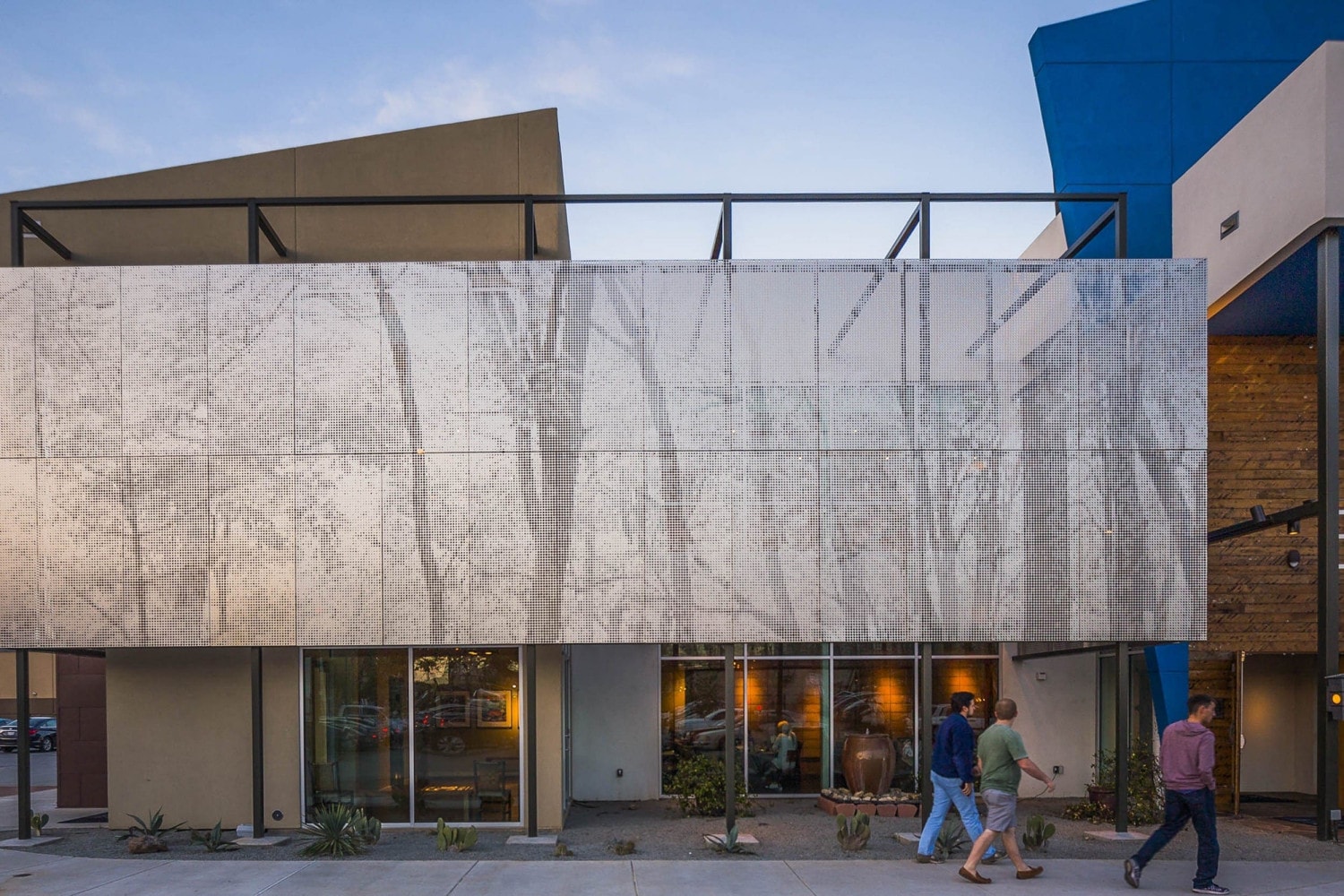 Restaurant facade and ImageWall screen in angel hair stainless steel with imagery of tree branches.