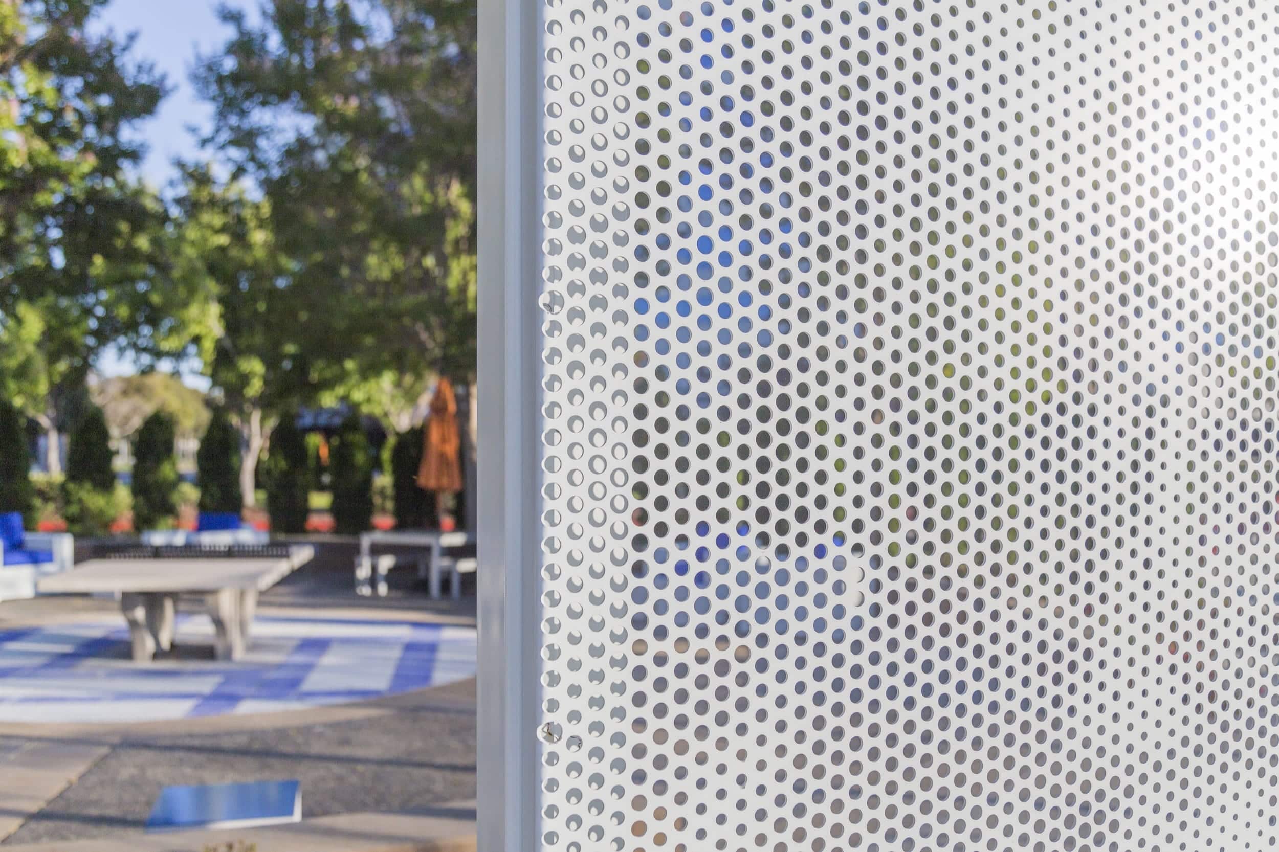 Curved free-standing ImageWall screen in painted aluminum for 1850 Gateway Courtyard.