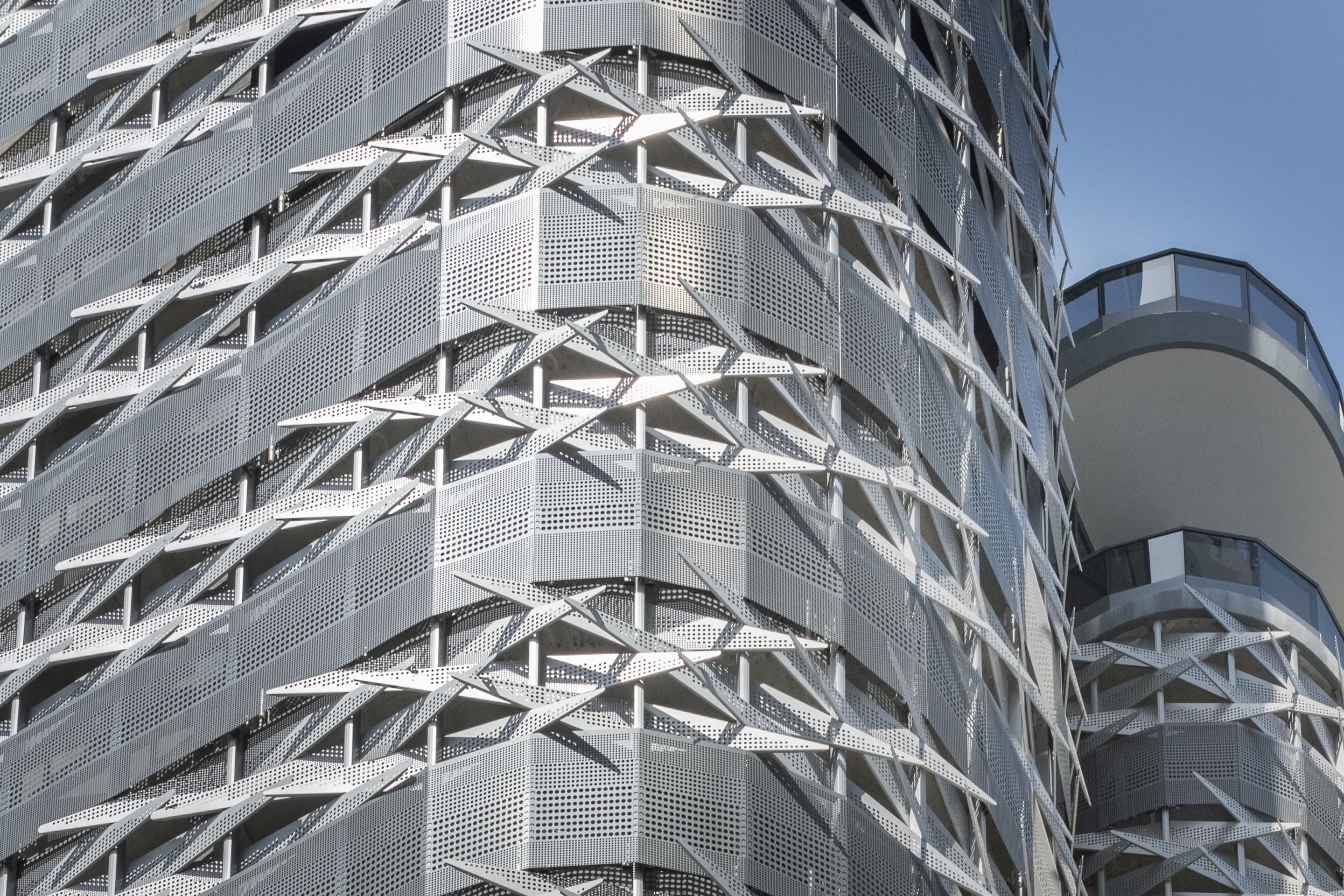 Custom perforated-metal facade for Brickell Flatiron in Miami, produced by Zahner.