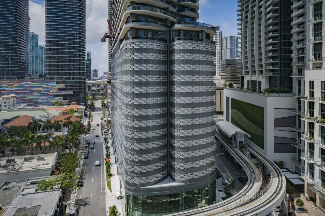 CUSTOM PERFORATED-METAL FACADE FOR THE 13-STORY BRICKELL FLATIRON PARKING GARAGE.