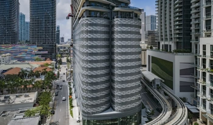 CUSTOM PERFORATED-METAL FACADE FOR THE 13-STORY BRICKELL FLATIRON PARKING GARAGE.
