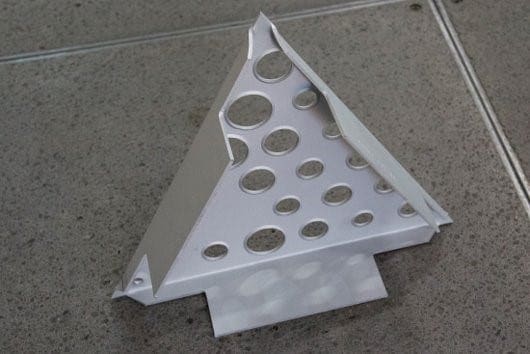 Custom tooling was designed by Zahner for creating the softened edges around the perforations.