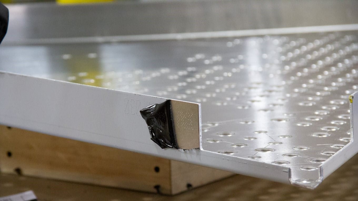 Dot Code closeup Closeup of the inscribed "dot code" used to track the panel through the fabrication, shipping, and installation processes.