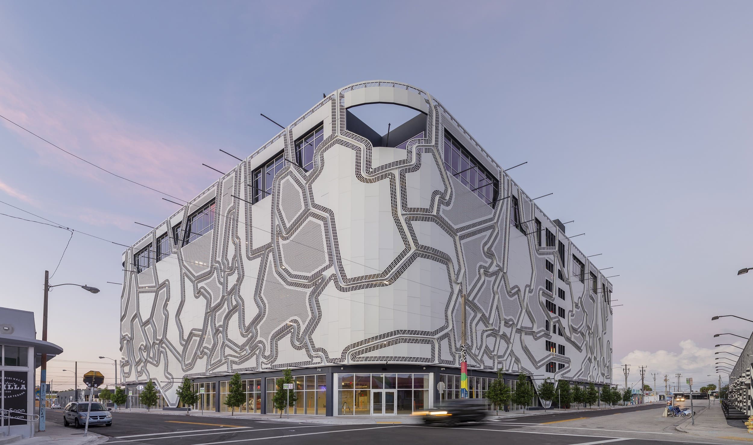 The Wynwood Garage features a painted aluminum facade with perforated planes that create multiple sight-lines. The wall is also designed to allow for additional artwork to be hung on the facade.