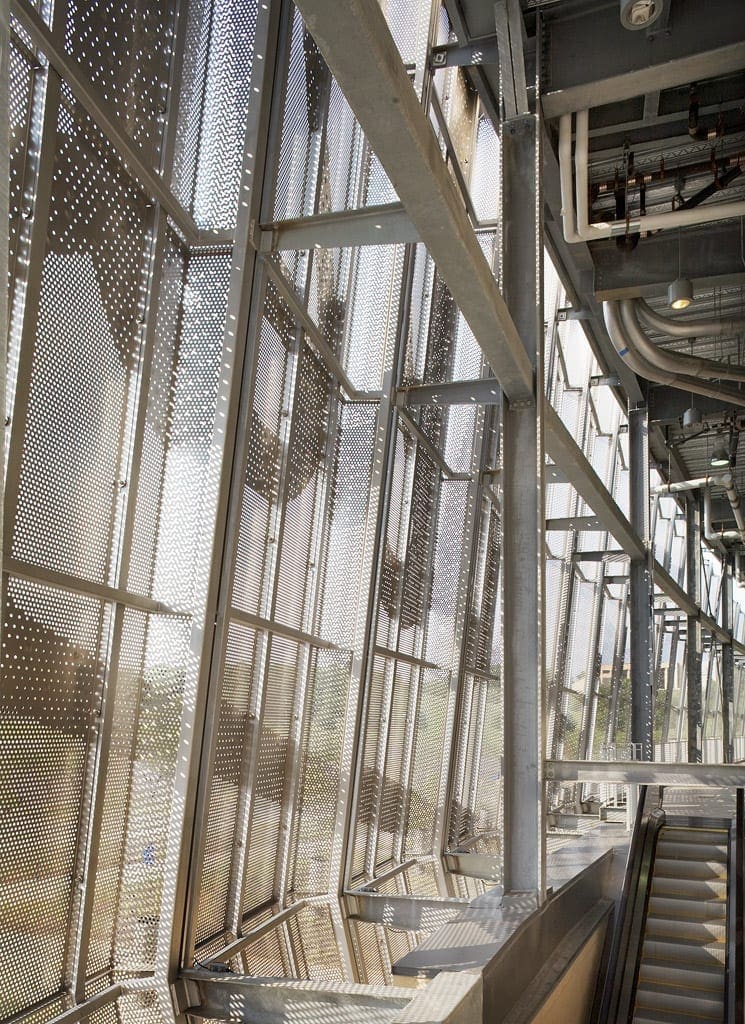 Light flows through the perforated metal facade at Kauffman Stadium