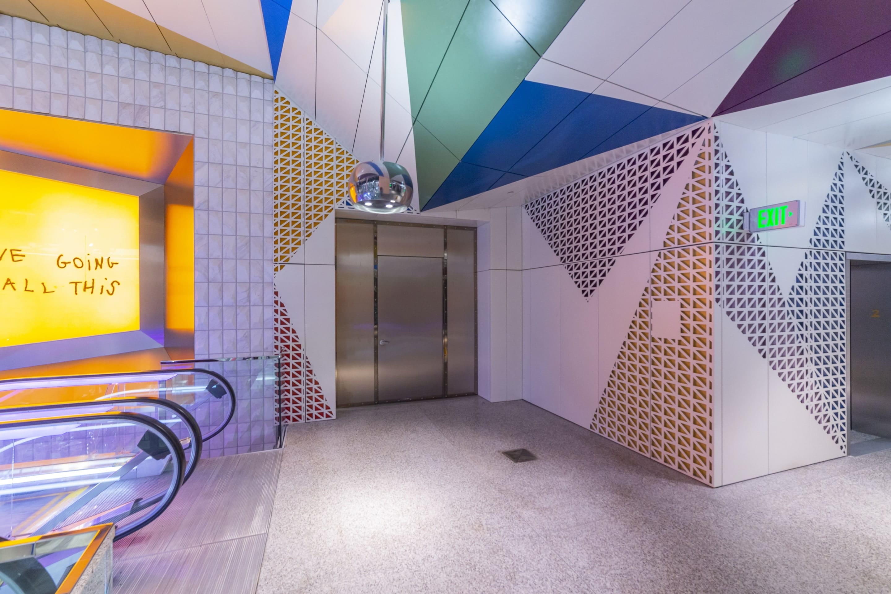 View of the soffit and wall systems near the escalators on the second floor.