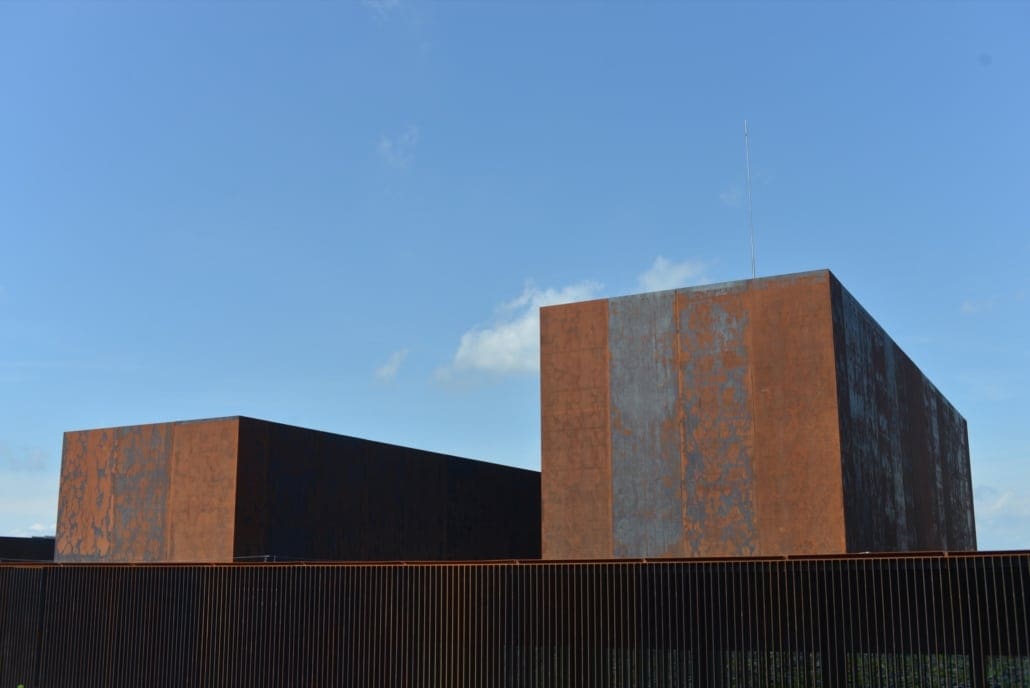 Different rates of weathering occur with Corten steel, as seen on the facade of the Musée Soulages in Rodez, France.