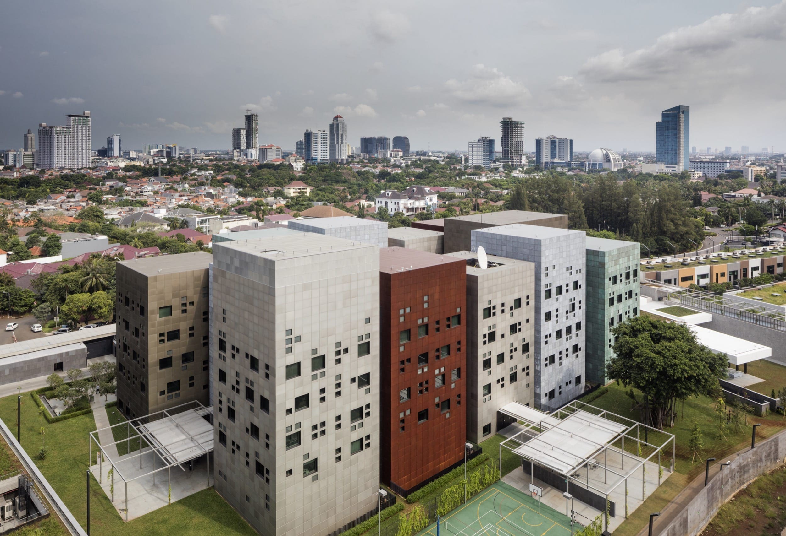 The Australian Embassy complex in Jakarta, designed by Denton Corker Marshall, features buildings clad in Solanum Steel, anodized clear and gold aluminum, and Zahner's Star Blue Copper and Hunter Zinc.