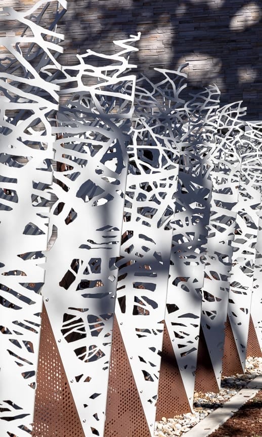 "In the Fold", designed by Norie Sato, combines perforated Solanum steel and "Frost White" anodized aluminum in a folded pattern evocative of origami.