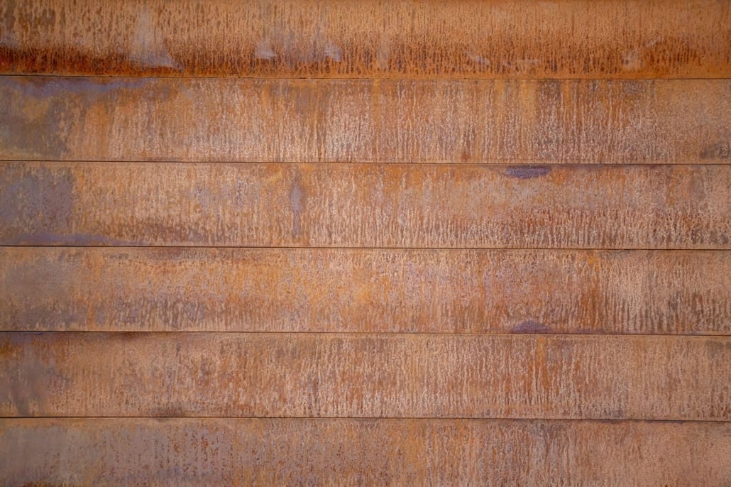 Streaking and heterogeneous weathering are common challenges with traditional Corten weathering steels.