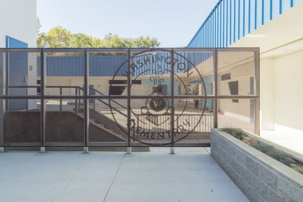 Perforated screen walls within the courtyard further define spaces for movement and rest, while also providing another opportunity to emphasize school spirit.