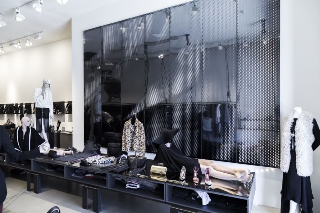 The feature wall at Laura Gambucci boutique features black interference stainless steel.