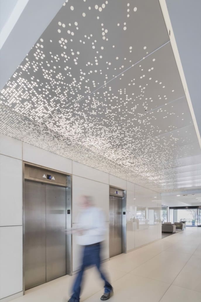 The lobby of the 6060 NCX building in Dallas features an anodized aluminum ImageWall ceiling.