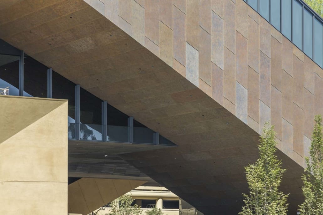 The facade and soffit of the McMurtry Building in Stanford, CA, featuring preweathered Baroque Zinc™ patina.