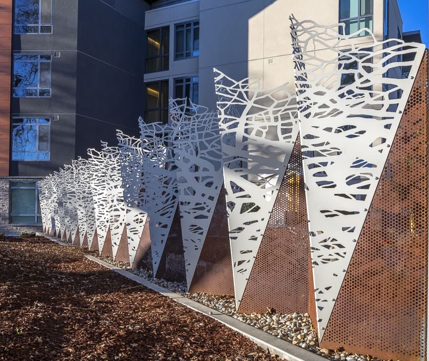 "In the Fold" fence by artist Norie Sato, featuring Solanum weathering steel and "Frost White" anodized aluminum.