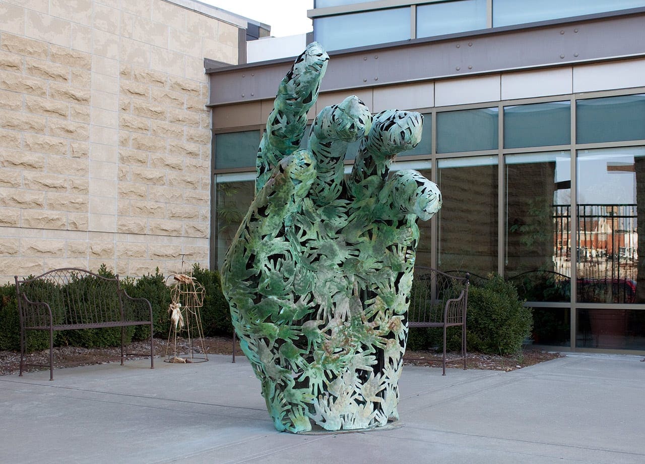 Several hundred copper hands were hammered into individual shapes to form The Hands of Man artwork by L. William Zahner.