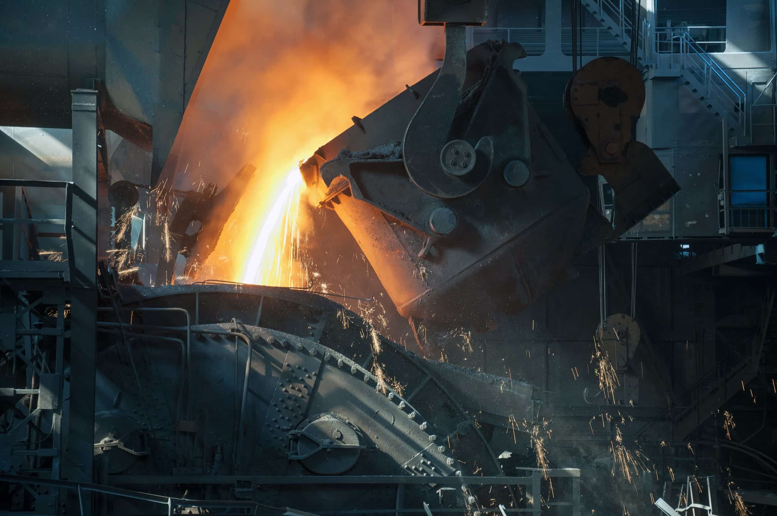 Molten metal is poured into a mould at a metal manufacturing facility.
