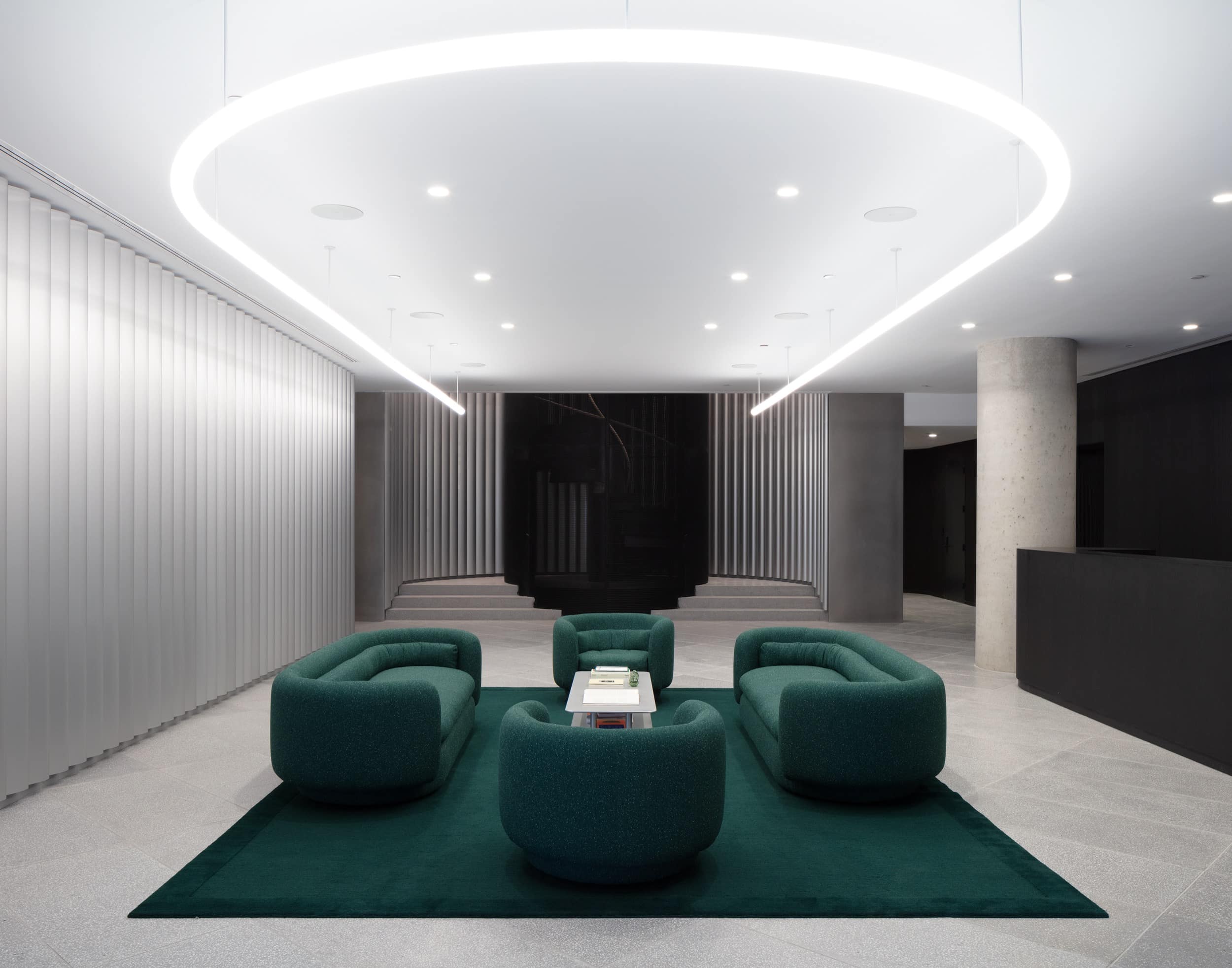 The Leong Leong-designed lobby features curving, extruded aluminum metal walls.