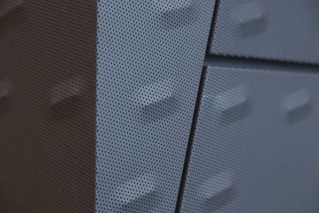 DETAIL OF THE PUNCHED AND CUSTOM-EMBOSSED ZINC PANELS AT KCPD HEADQUARTERS.
