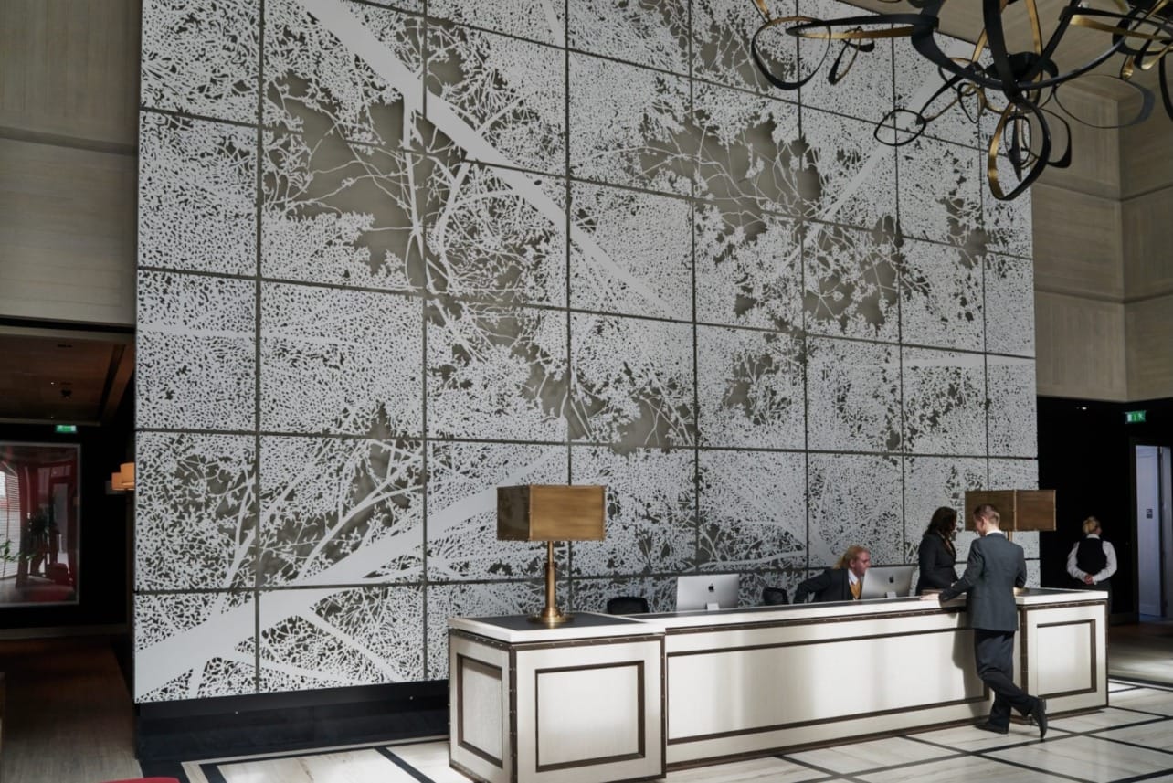 Interior art wall featured within the lobby of the Embassy Gardens in London.