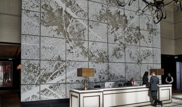 Interior art wall featured within the lobby of the Embassy Gardens in London.